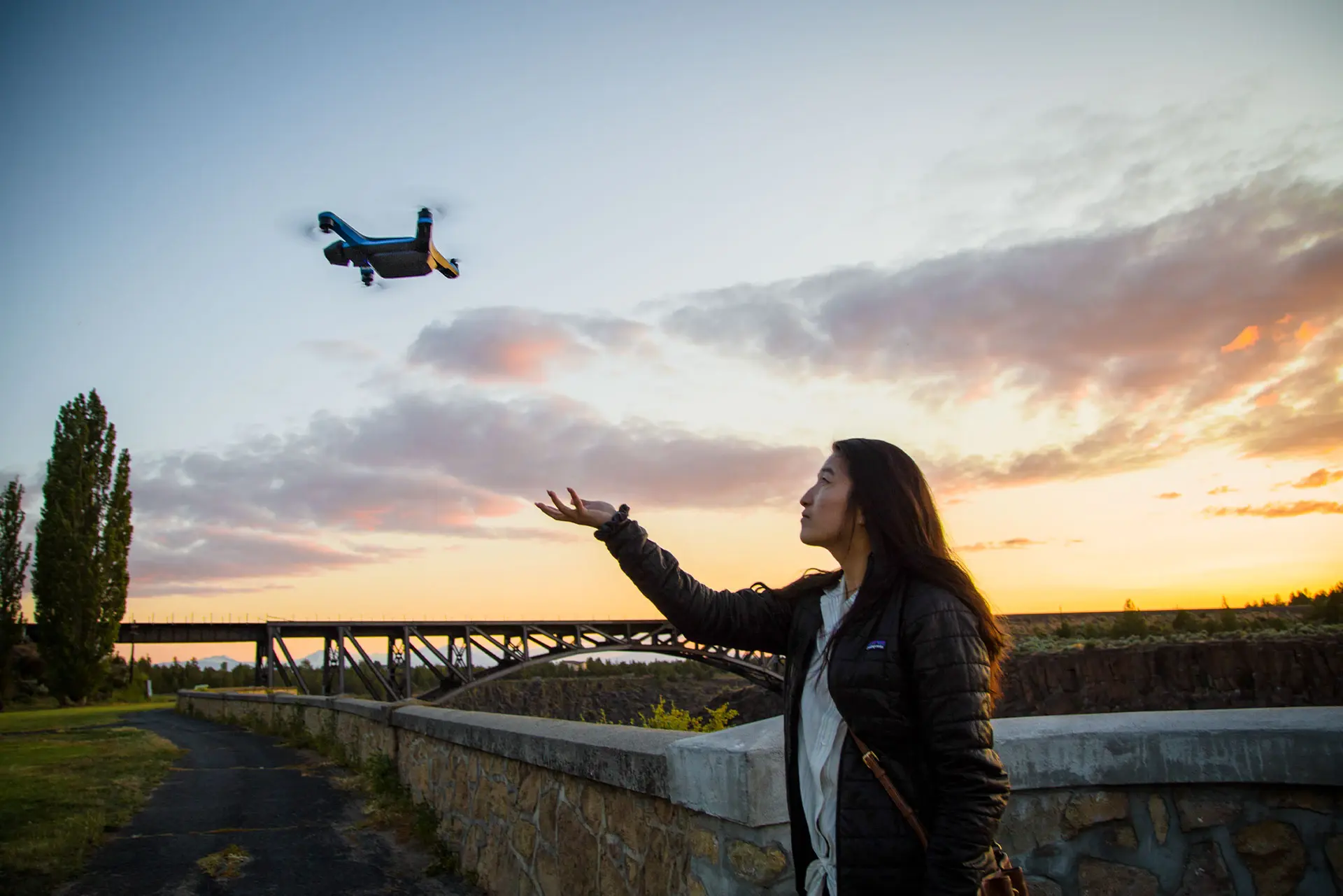 Woman Launching Drone at Sunset Dwyka Mining Partners with Skydio to Transform Aerial Tech in Joburg